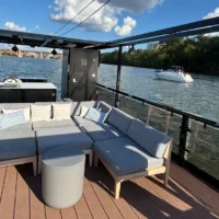 Grey sectional sofa on houseboat deck